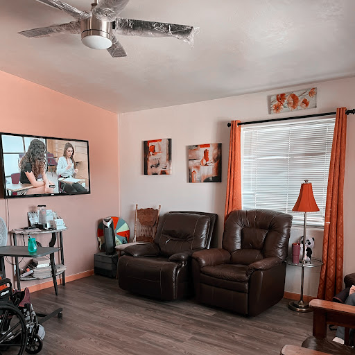 A cozy living room setup featuring a comfortable seating area and vibrant decor.