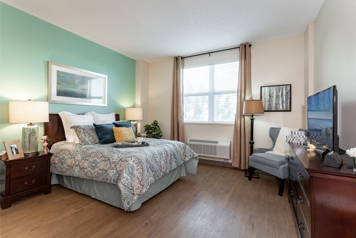 A modern and well-lit bedroom with stylish decor and furnishing.