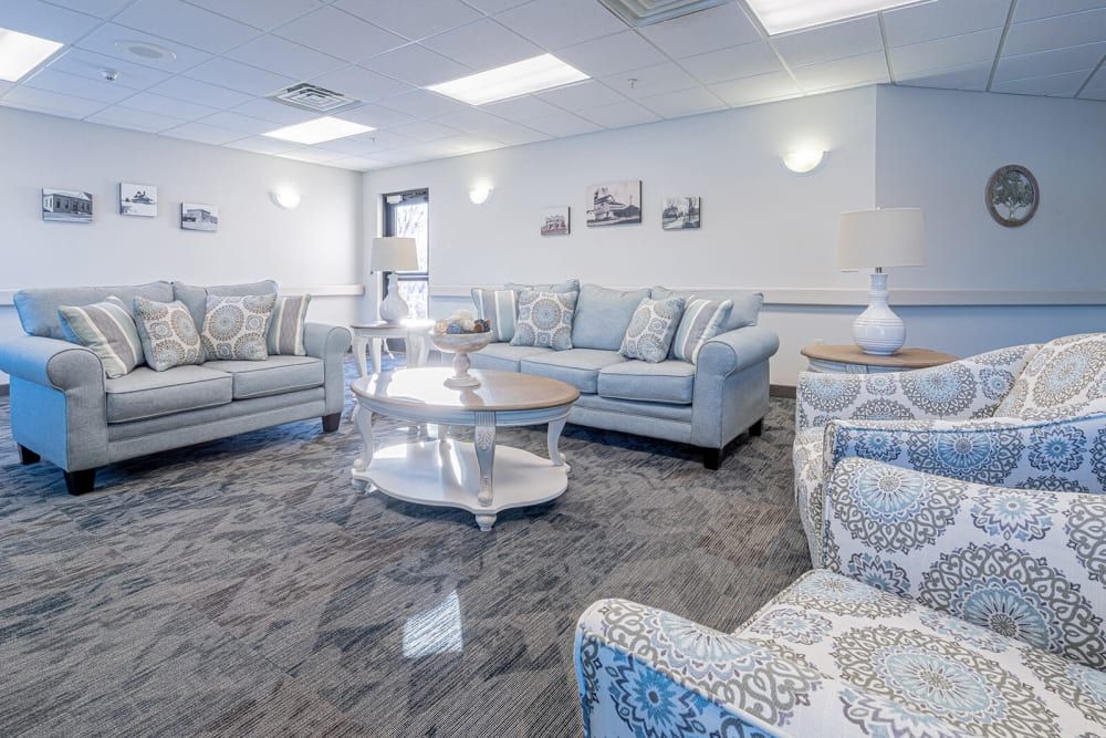 A modern living room with comfortable seating and elegant decor.