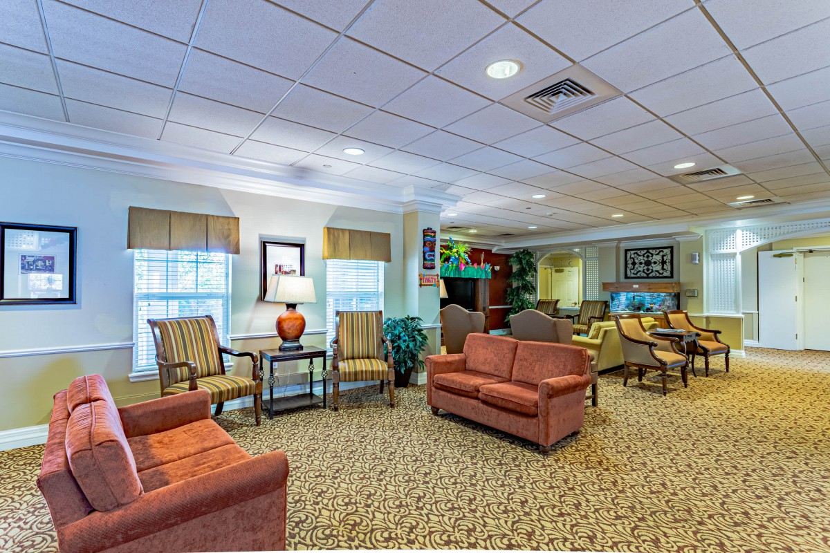 A cozy living room with comfortable seating and warm lighting.