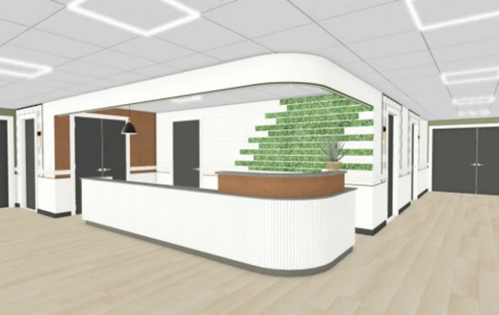 A modern reception area with a sleek design and green accent wall.