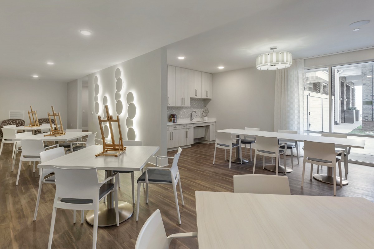 A modern dining area with minimalist furniture and clean design.