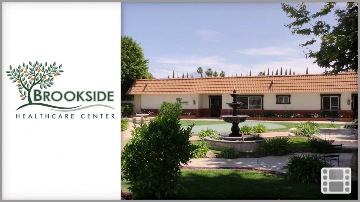 A tranquil view of a rehabilitation center with a central fountain and landscaped garden.
