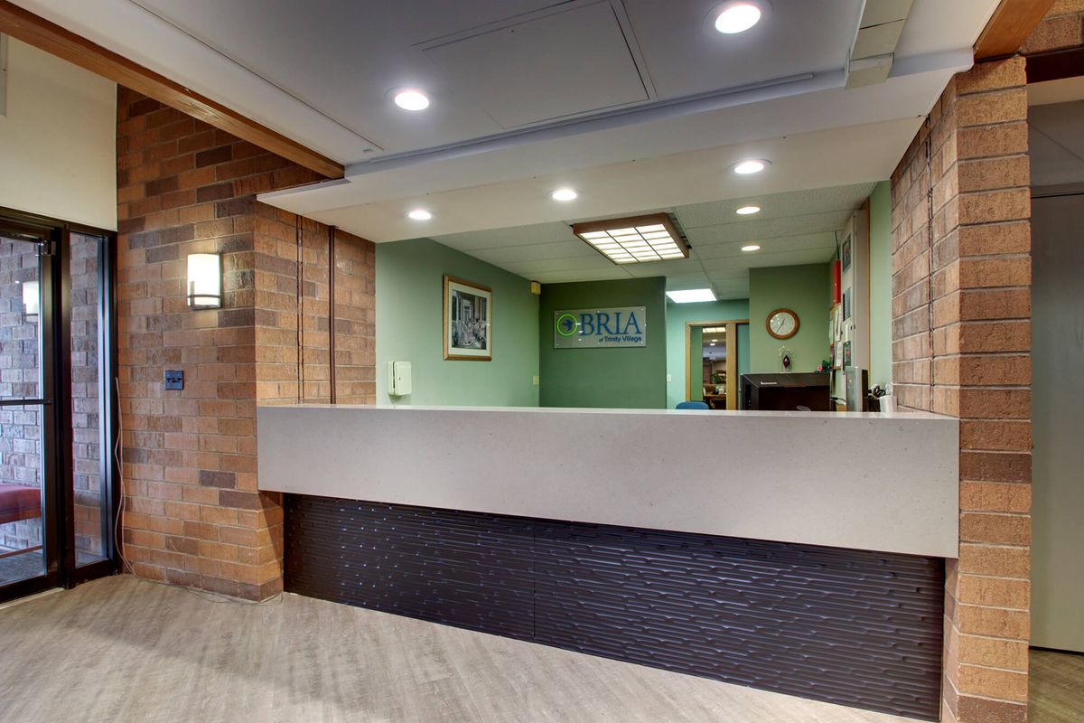 A modern reception area with a sleek design and ambient lighting.