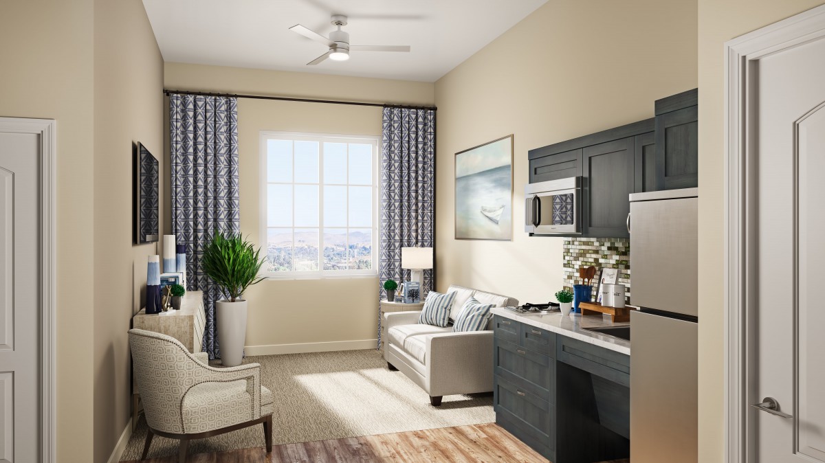 A modern living room with stylish decor and a large window providing ample natural light.