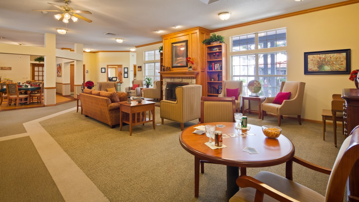 A cozy living room with comfortable seating and a fireplace.