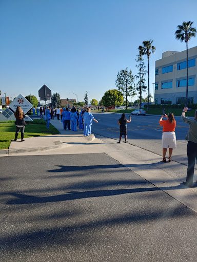 Healthcare workers gather outside in a show of solidarity.