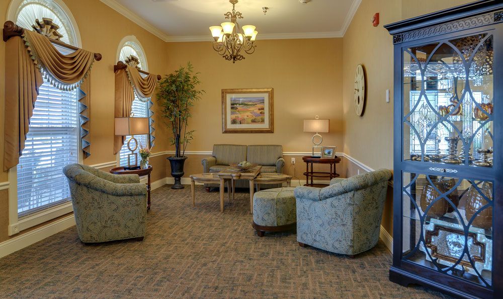 A cozy living room with comfortable seating, elegant lighting, and tasteful decor.