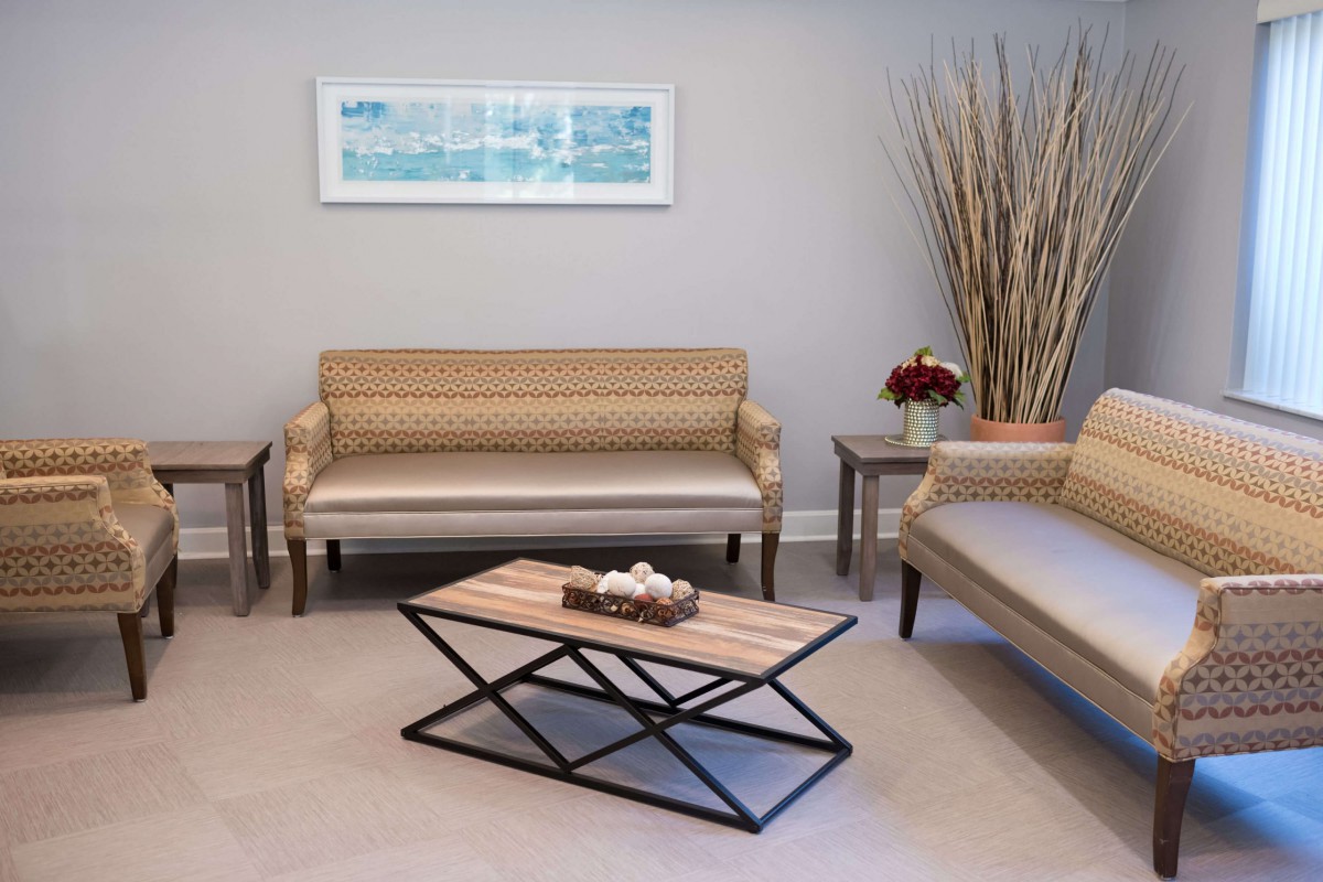A modern living room with elegant furniture and minimalist decor.