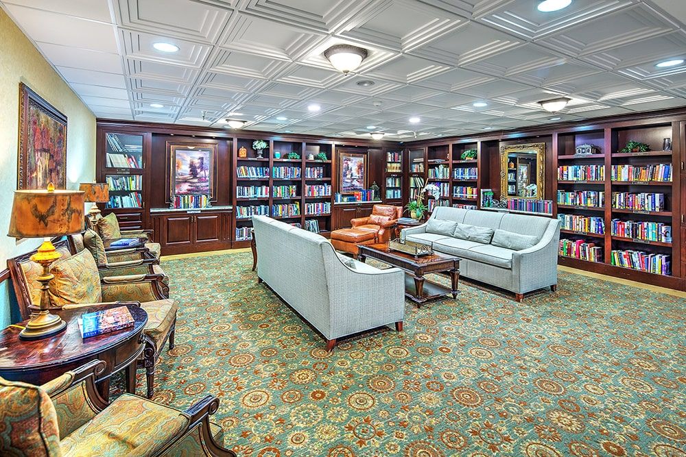 A cozy library with comfortable seating and well-stocked bookshelves.