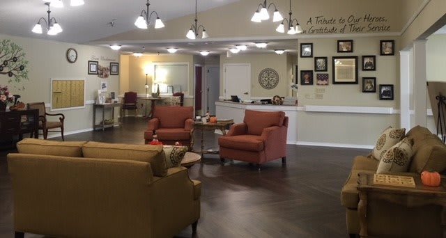 A cozy lobby with comfortable seating and warm lighting.