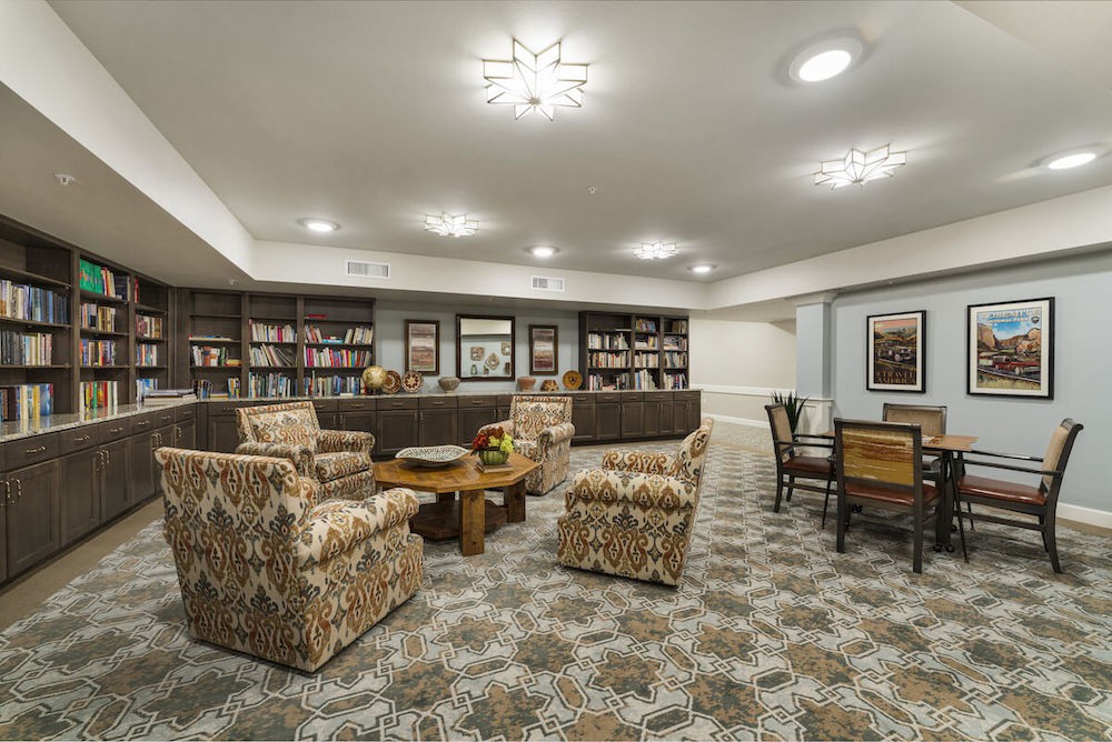 A cozy library interior with comfortable seating and bookshelves.