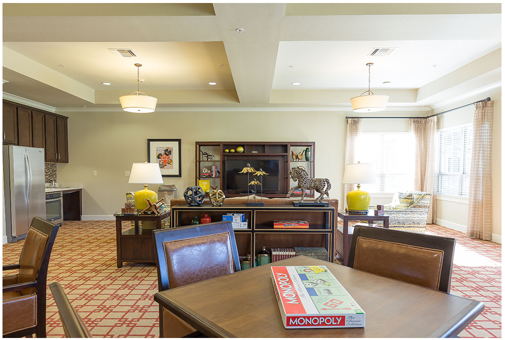 A cozy living room with board games on the table and comfortable seating.