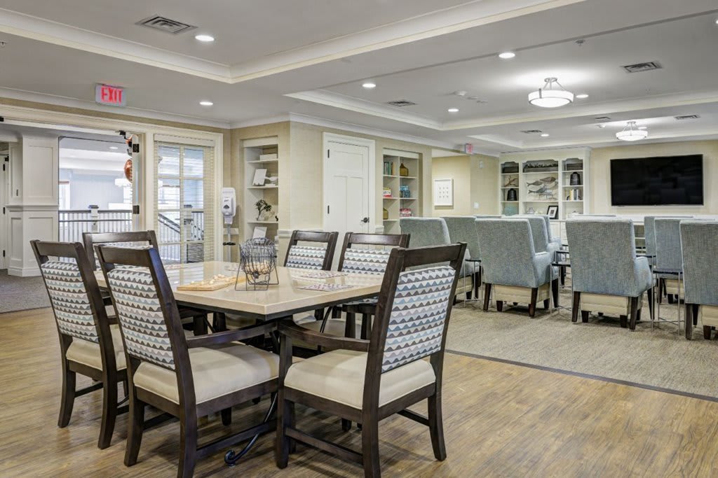 A well-designed dining room with elegant furniture and lighting.