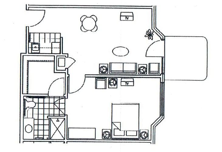 A floor plan of a one-bedroom apartment showing the layout including a kitchen, living room, and bathroom.