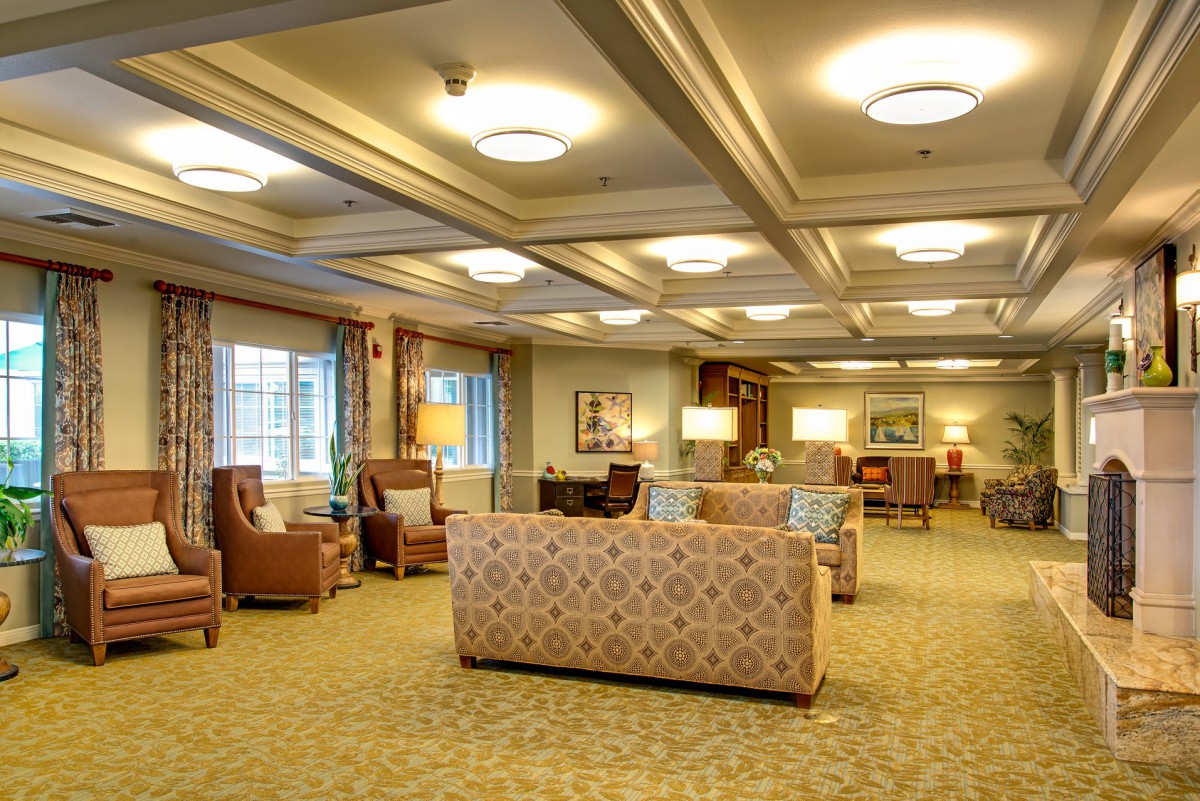 A spacious and well-lit lounge area with comfortable seating and elegant decor.