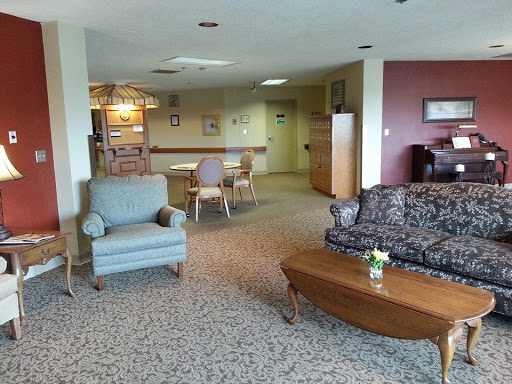 A cozy lounge area featuring comfortable furniture and a warm, inviting atmosphere.