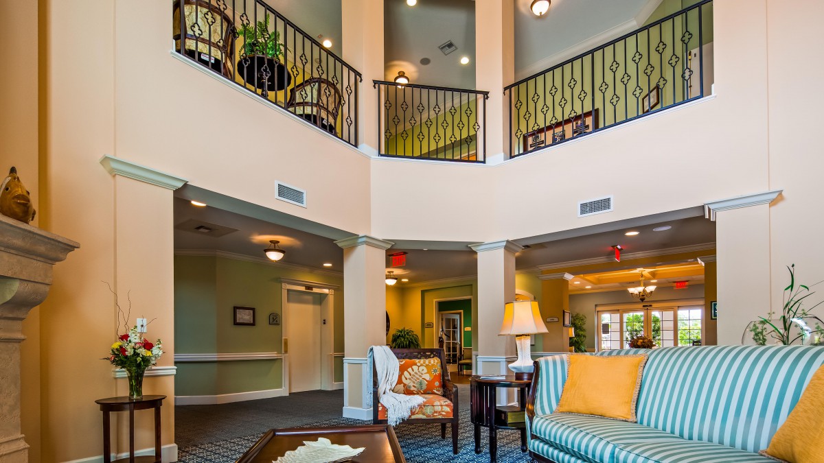 A spacious and elegantly decorated lobby with comfortable seating and warm lighting.