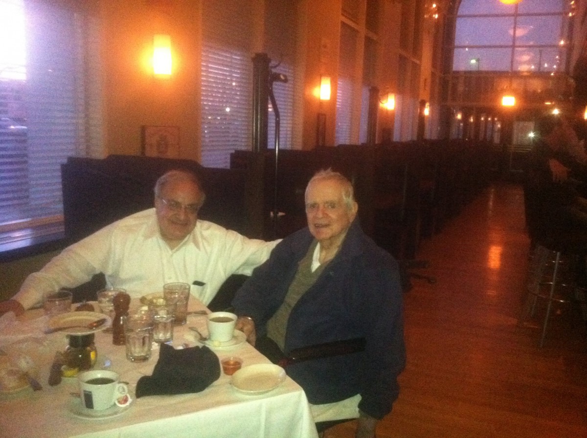Two people enjoying a meal together at a restaurant.