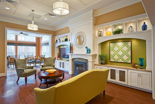 A stylish and welcoming lounge area featuring comfortable seating, modern decor, and warm lighting.
