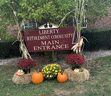 Welcome to Liberty Retirement Community - Main Entrance, beautifully decorated for fall.