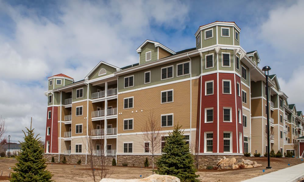 A modern multi-story residential building with a unique architectural design.
