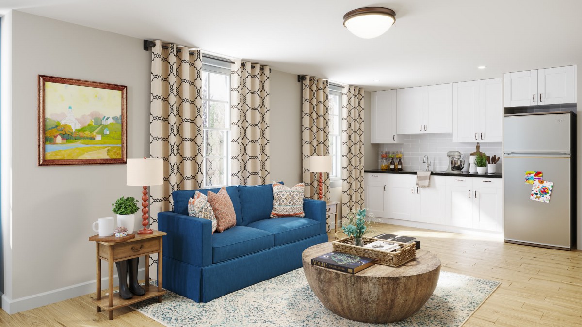 A modern living room with a blue sofa, wooden coffee table, and stylish patterned curtains.
