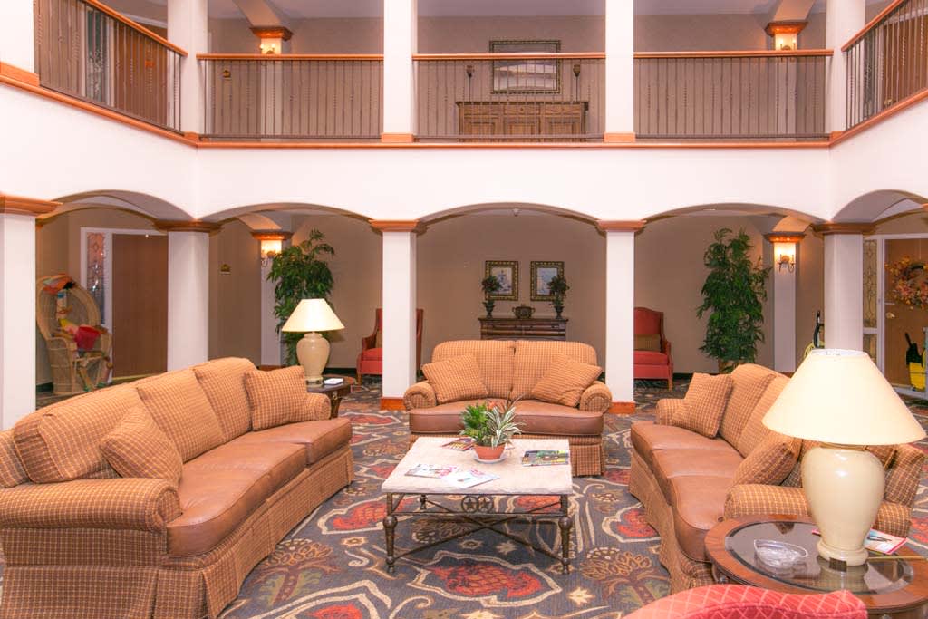 A spacious hotel lobby with comfortable seating and elegant decor.