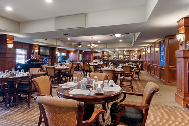 An elegant dining area in a restaurant, featuring well-arranged tables and chairs.