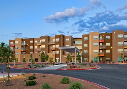 A modern apartment complex with landscaped grounds and a welcoming entrance.