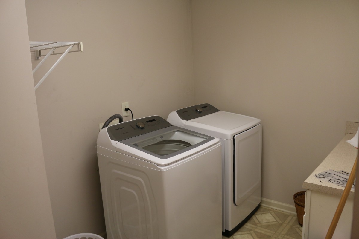 A laundry room featuring a washing machine and a dryer.