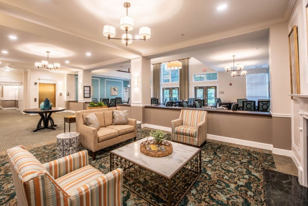 A spacious and elegantly designed lobby area with comfortable seating and warm lighting.