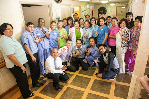 A dedicated team of healthcare professionals gathered together, showcasing their unity and commitment to patient care.