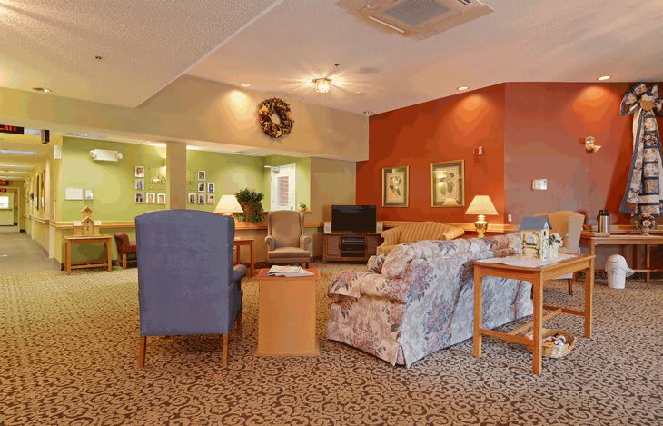 A cozy living room with comfortable furniture and warm lighting.