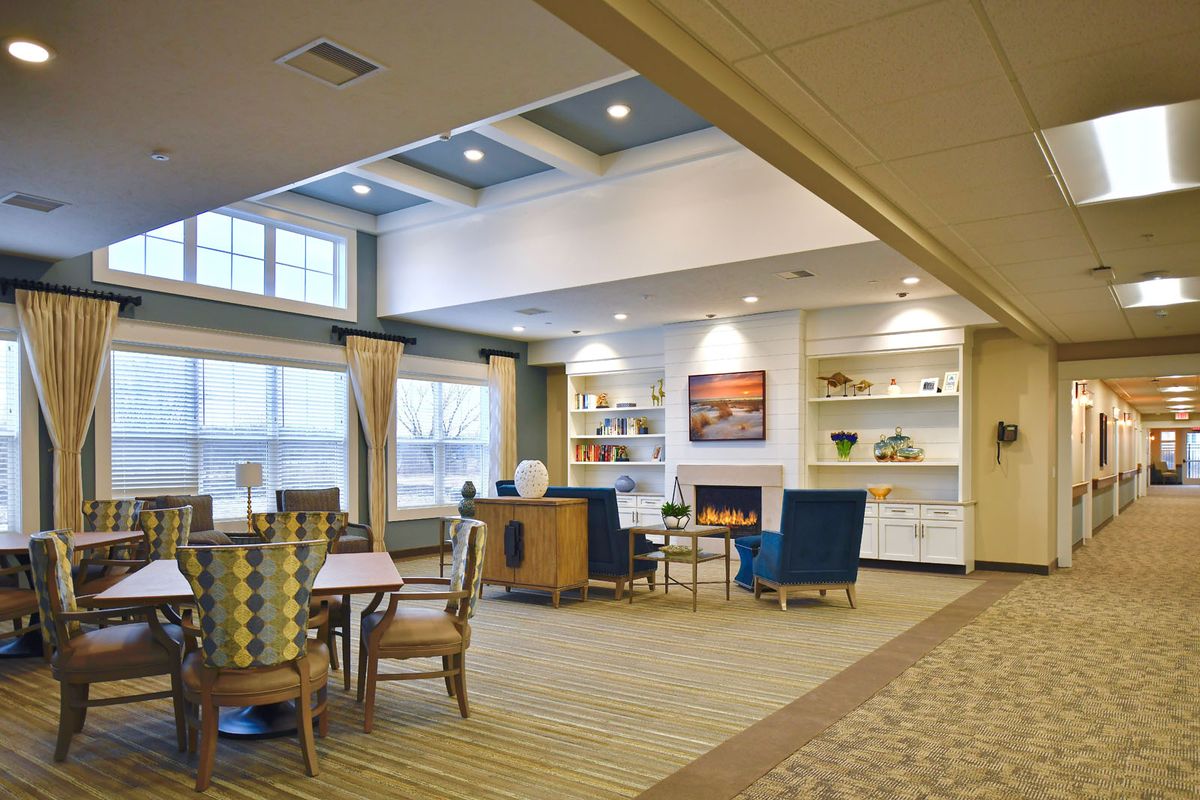 A modern living room with comfortable seating and ample natural light.