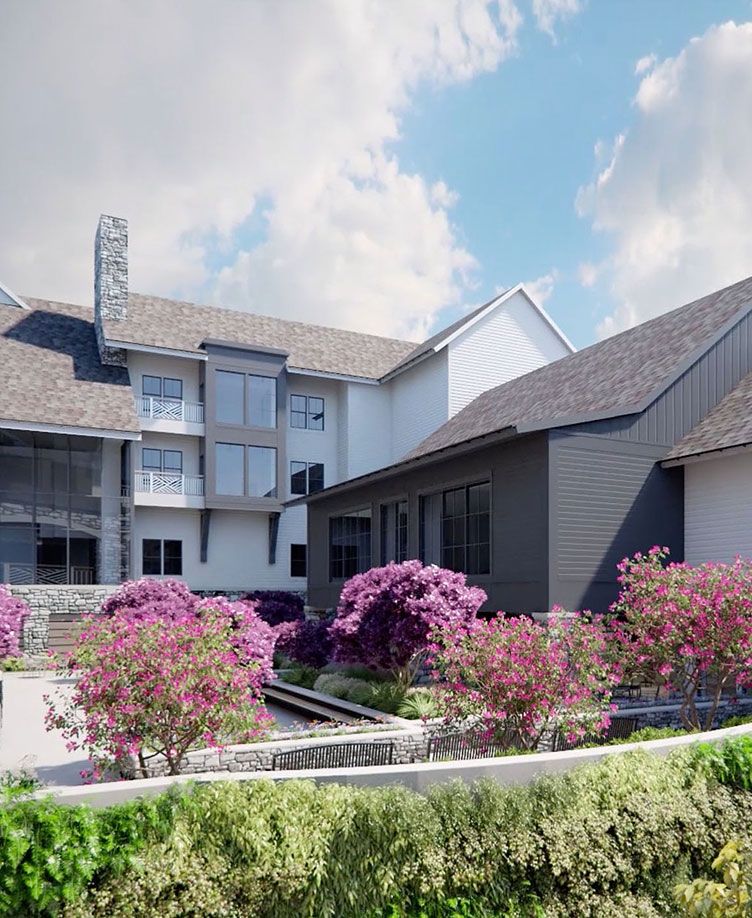 A modern residential house with well-landscaped gardens featuring vibrant flowers.
