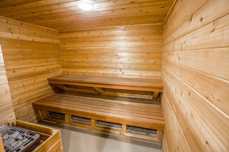 A cozy wooden sauna with a bench for relaxation.