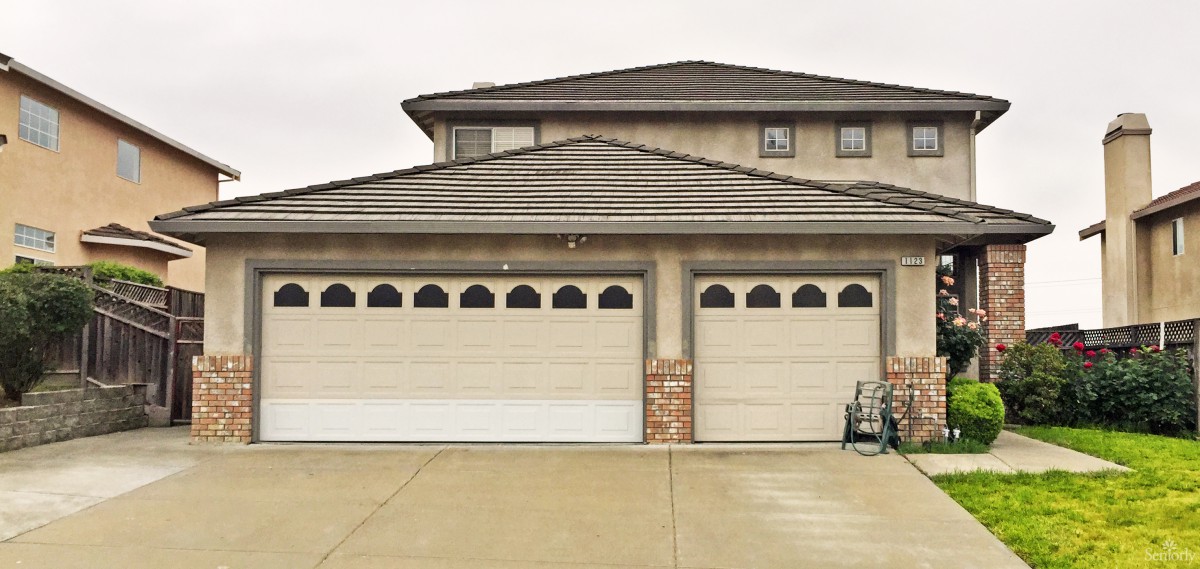 A two-story suburban home with a three-car garage.