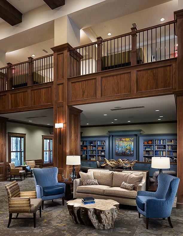 A cozy library with comfortable seating and bookshelves.
