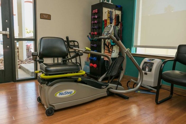 Recumbent stepper machine in a rehabilitation setting.
