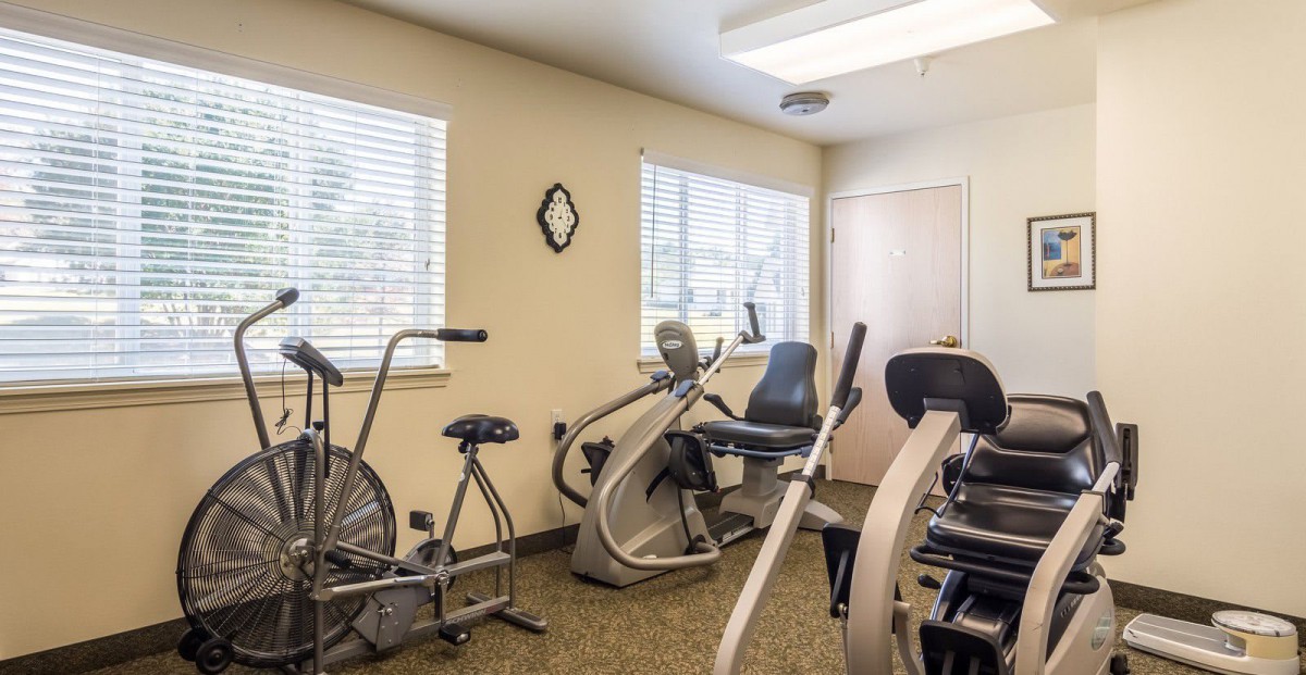 A small gym with exercise bikes and fitness equipment.