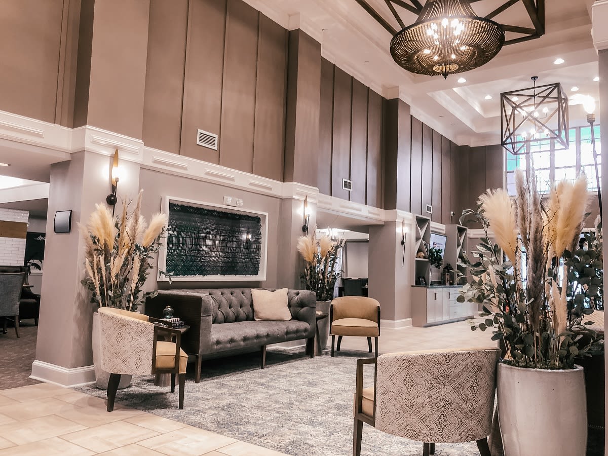 A luxurious hotel lobby with elegant seating and modern design elements.