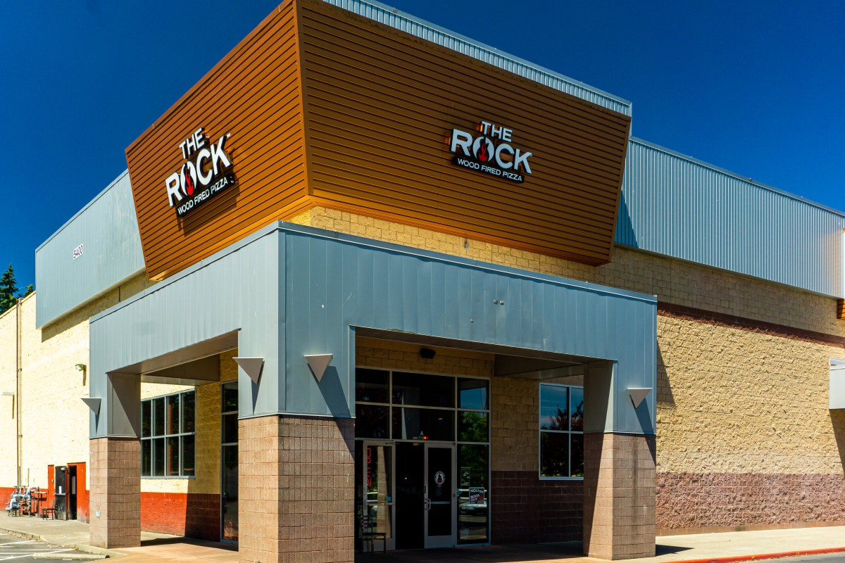 The exterior of a restaurant building with prominent signage.