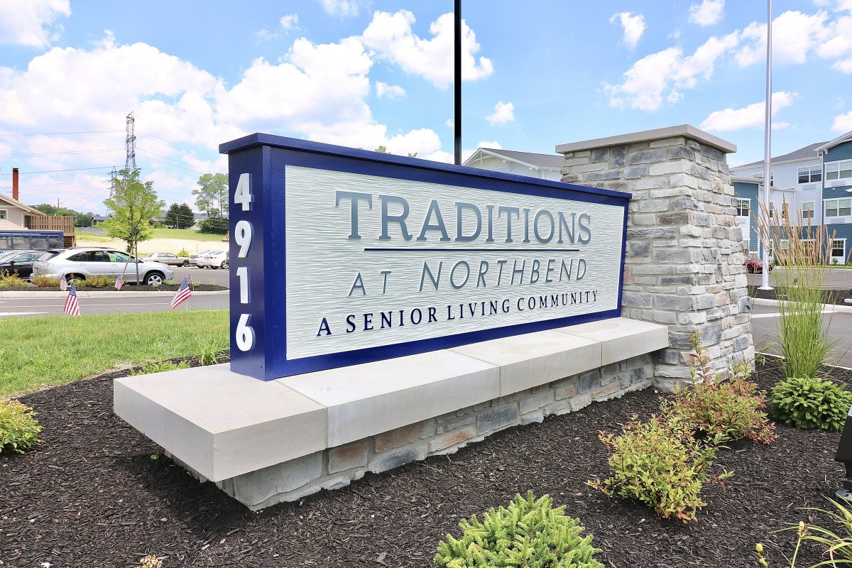 Sign for Traditions at Northbend, a senior living community.