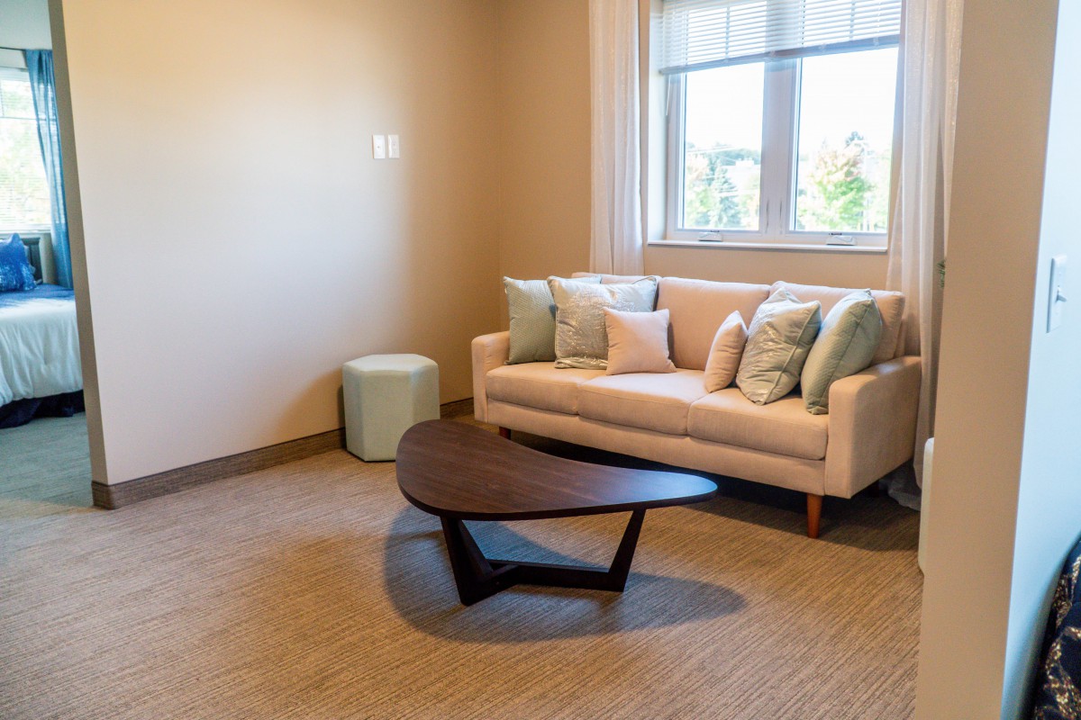 A modern living room with a stylish sofa and coffee table.