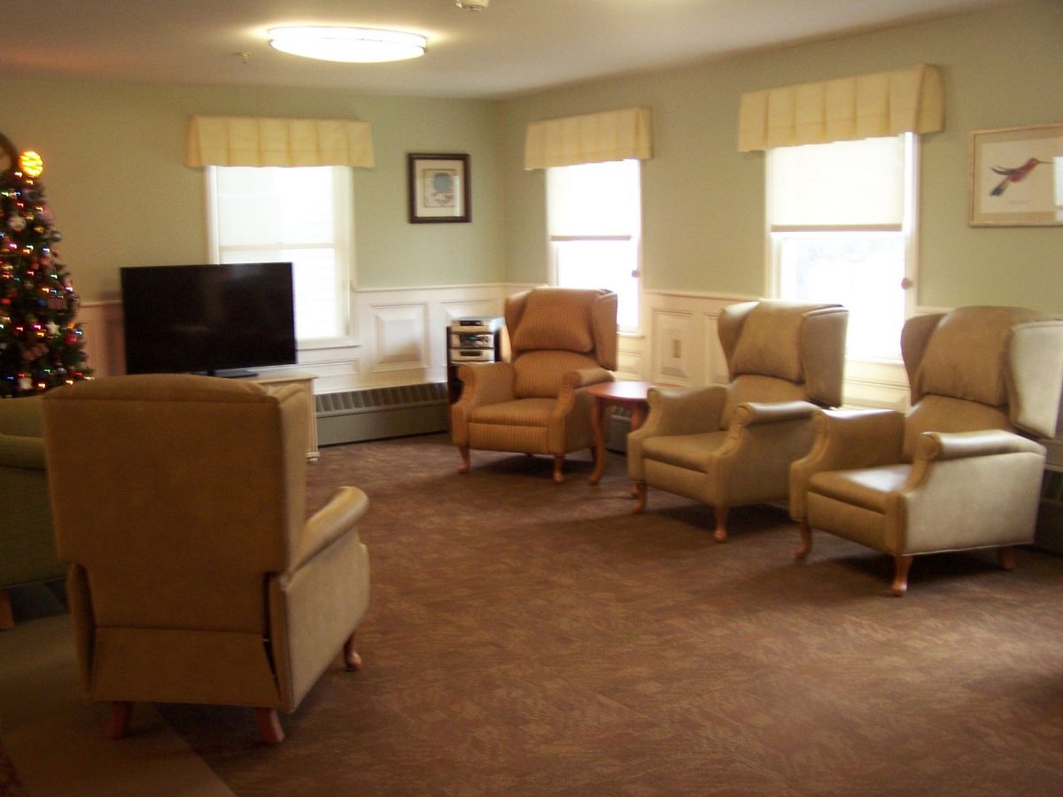 Cozy living room with comfortable chairs and a television.