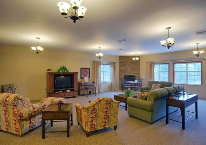 A cozy living room with comfortable seating and a television.