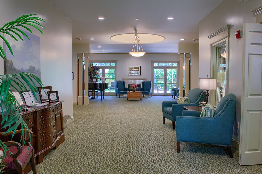 A spacious lobby with comfortable seating and elegant lighting.