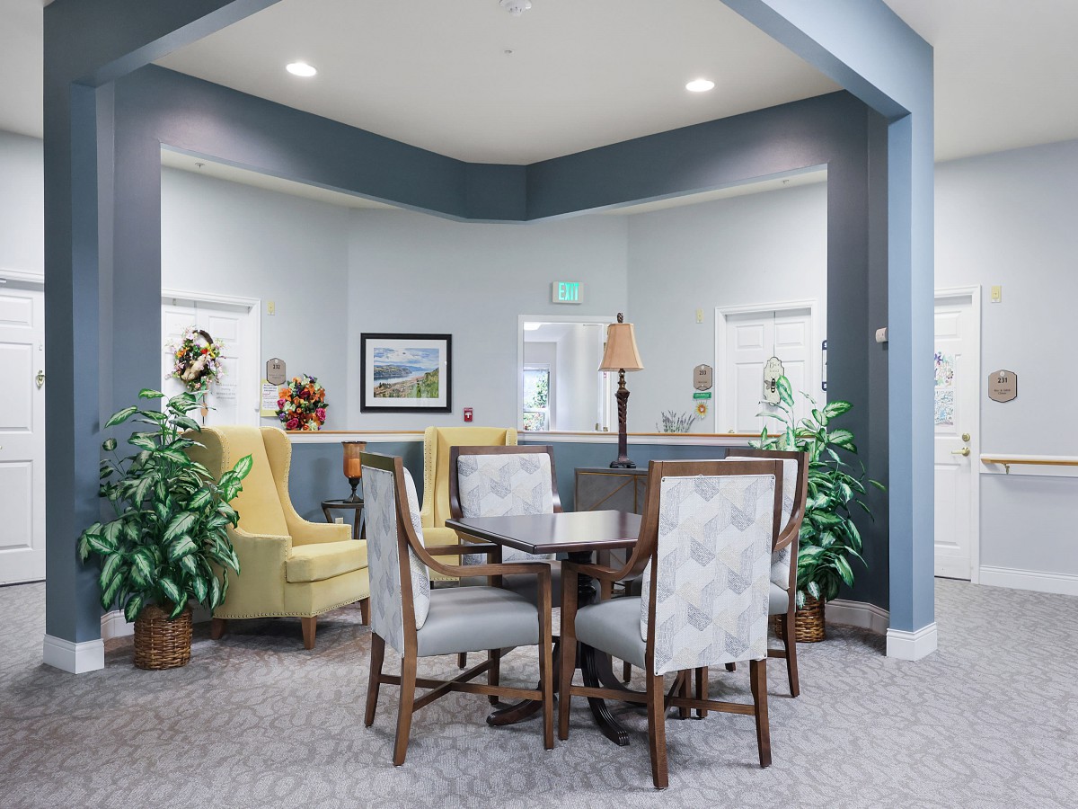 A brightly lit lobby area with comfortable seating and tasteful decor.