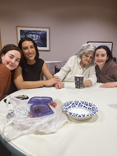 A cherished family moment with smiles and love around the table.